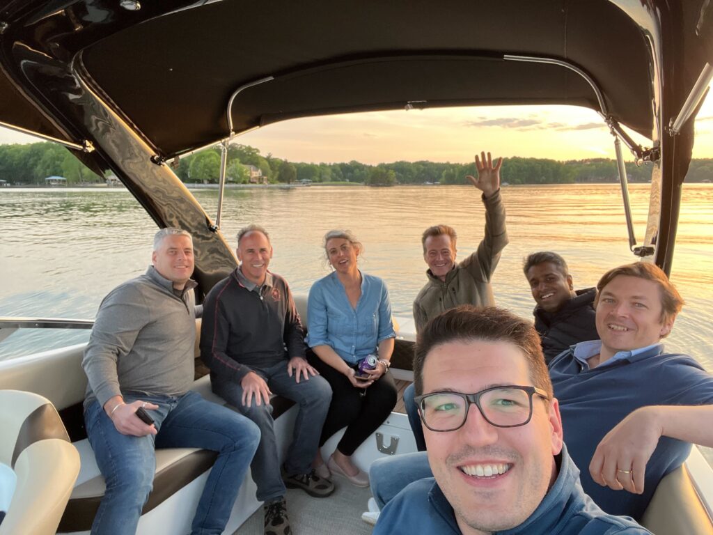 Selfie photo on boat of Taulia employees