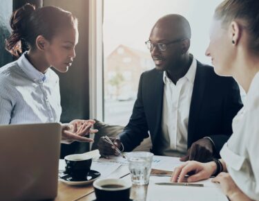 group of people in meeting discussion