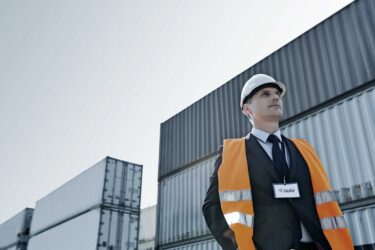 Man in building construction gear and helmet image